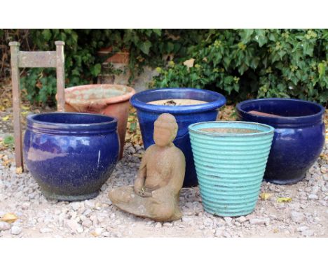 A GROUP OF VARIOUS FLOWER POTS the largest 38cm diameter x 34cm high together with a wrought iron boot scraper and a small st