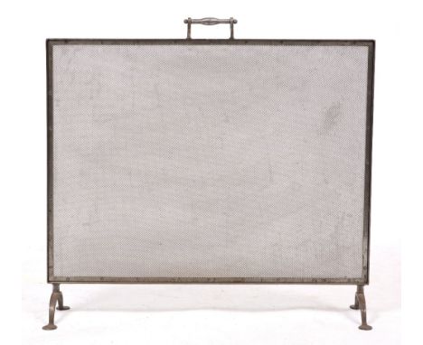 A POLISHED STEEL FIREGUARD  with turned handle to the top rail and spreading feet 81cm wide x 76cm high overall