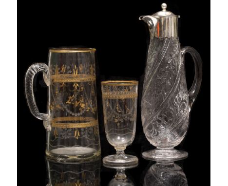 AN EARLY 20TH CENTURY CRYSTAL CLARET JUG by Williams and Stevens, Stourbridge, of ovoid form with polished intaglio cut and s
