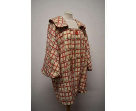 A late 1950/1960s cream wool swing coat, having pink, beige and white checked pattern, portrait collar, singled button fasten