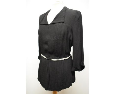 A 1940s crepe blouse having belted waist, 3/4 sleeves and button back fastening, larger size.