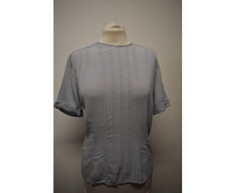 A 1940s/50s blouse in a pale blue, having buttons fastening to reverse and ladder work to front, Bernella label to nape, to f