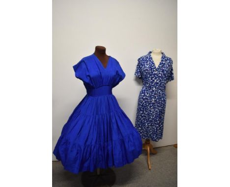 A 1940s Royal blue tiered dress, having full skirt and fitted under bust,sold with a patterned cotton day dress with button d