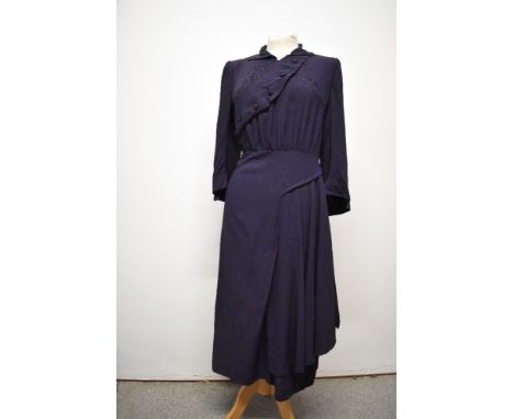 An unusual 1940s navy blue crepe day dress, having diagonal button fastening to bust, with purple embroidered accents to blue