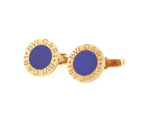 
Bulgari Manschettenknöpfe in 750er Gold mit Lapis lazuli 

Material: 750 Gelbgold
Edelsteine: Lapis lazuli
Durchmesser: 15,5