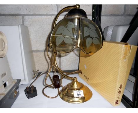 A table lamp and place mats