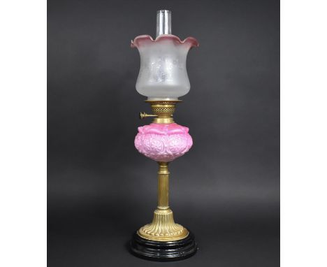 A Late Victorian Brass Based Oil Lamp with Ribbed Column on Circular Plinth, Pink Glass Reservoir and Two Tone Etched Shade, 