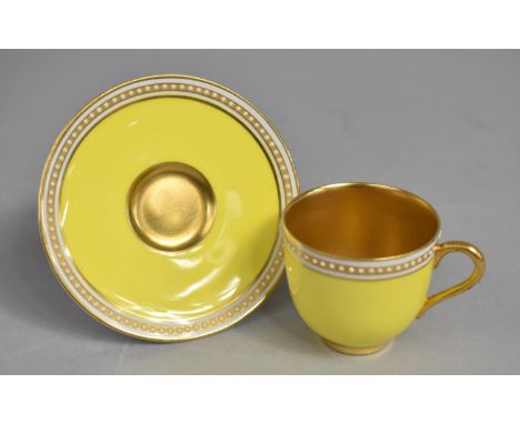 A Royal Worcester for Harrods Yellow and Gilt Cup and Saucer decorated with Jewelled Trim 