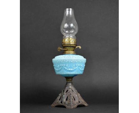 A Late Victorian Iron Based Oil Lamp with Moulded Blue Glass Reservoir and Plain Chimney, 46cms High 