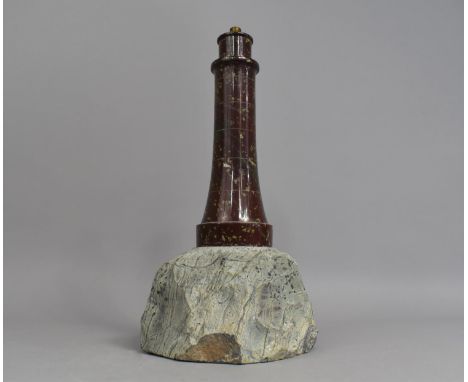 A Novelty Table Lamp Base in the Form of a Serpentine Marble Lighthouse Set on Rock Plinth, 35cms High 