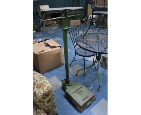 An Early 20th Century Green Painted Berry and Warmington Cast Iron Balance Beam Floor Scale, "The Weighwell" 