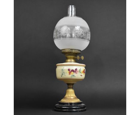 An Edwardian Oil Lamp with Brass Base on Circular Plinth Opaque Glass Reservoir, Decorated with Pansies, Etched Shade and Pla