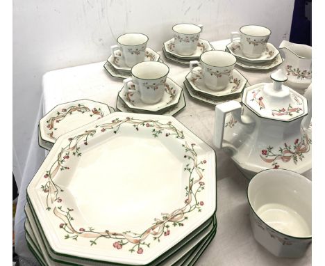 A large set of Johnson Bros eternal bow part tea part dinner service. 