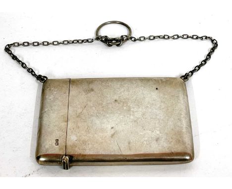 A George V card case of plain polished rectangular form with chain and ring handle, Chester 1911, makers mark for E J Trevitt