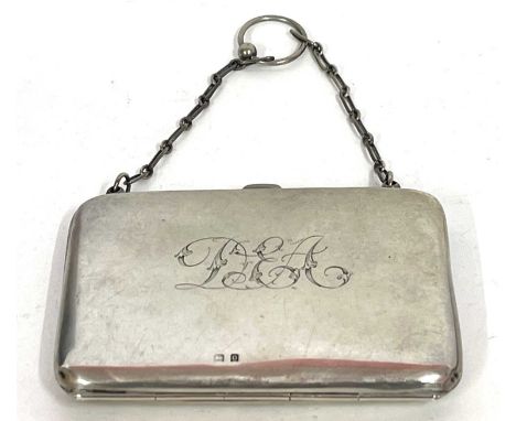 A George V silver card case of plain polished "bag" form, monogrammed, fitted interior with a chain and ring handle, Birmingh