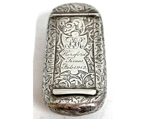 An Edwardian silver snuff box of slight curved rectangular form overall engraved with a foliate design, gilt interior, Birmin