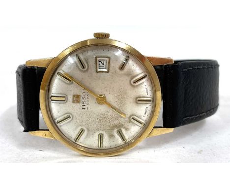 A 9ct gold gents Tissot wrist watch, the watch has a manually crown wound movement, hallmarked inside the case back, silver c