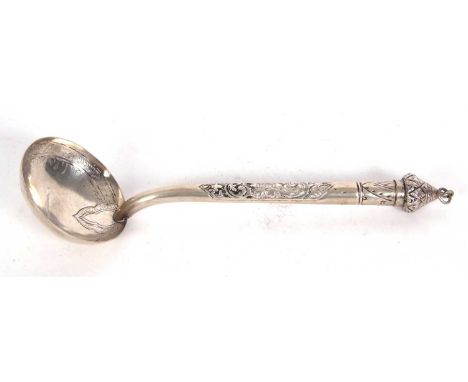 North African white metal ladle with engraved circular bowl chased hollow handle and pointed finial, 29cm long, 110gms