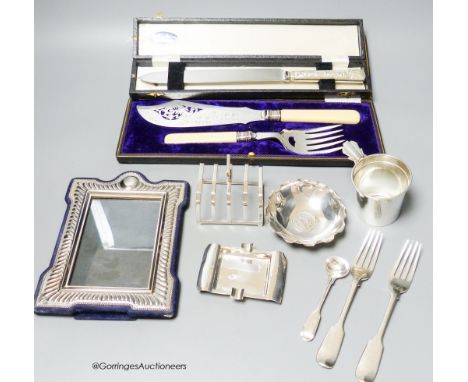   A small group of assorted silver including cup holder, dessert forks, mustard ladle, ashtray, a Wang Hing coin dish and toa