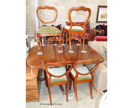   A George III style mahogany twin pillar extending dining table and six Victorian balloon back chairs, table 182 cm extended