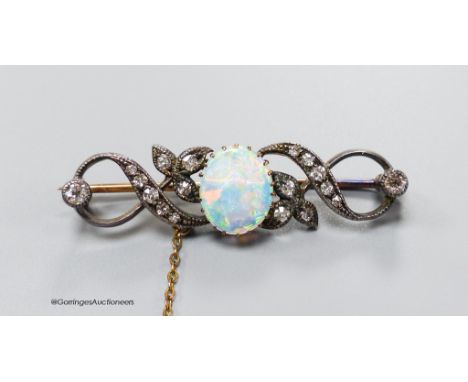   A late Victorian white opal and diamond cluster set scroll bar brooch, 43mm, gross 5.9 grams.