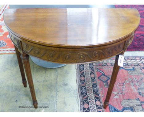   A George III style mahogany demi-lune card table. W-92, D-46, H-77cm.