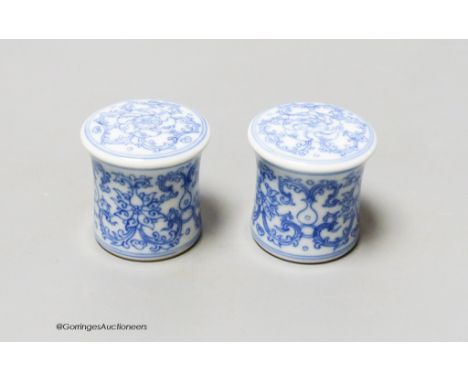   A pair of Chinese blue and white scroll ends, height 3.5cm