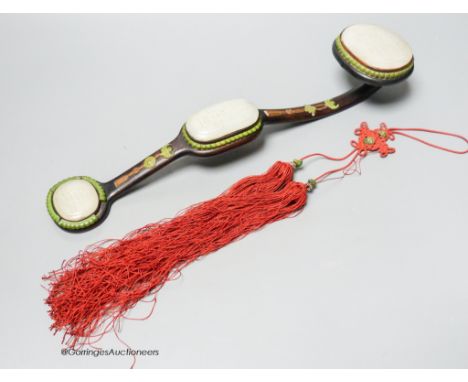   A Chinese jade and bone mounted zitan ruyi sceptre, 19th century,the pale celadon jade plaques carved in relief with the ch