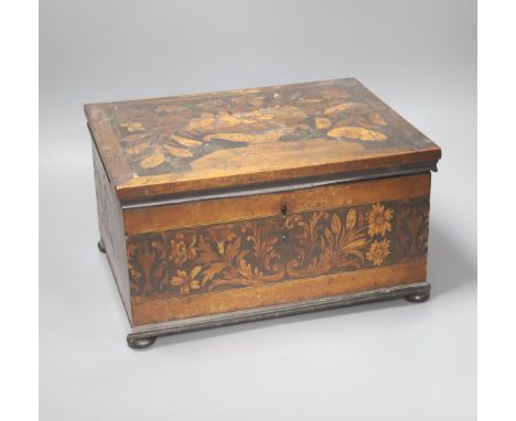   An unusual George IV ebony and marquetry inlaid tea caddy, 32cm