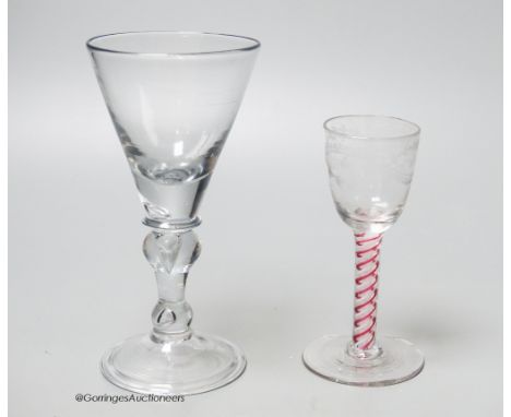   An early 18th century light baluster wine glass and an English red and white colour twist cordial glass, tallest 17.5cm