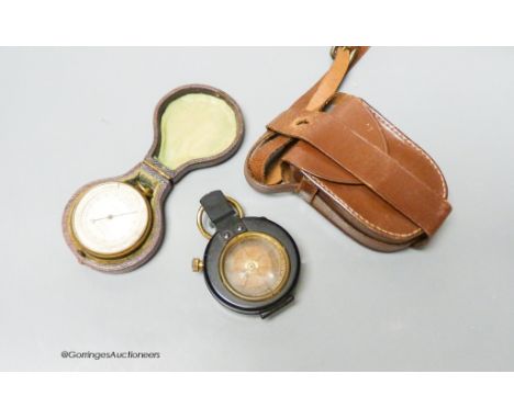   A small leather-cased military compass together with a cased compensated pocket barometer, E.Bryan, Manchester (2)