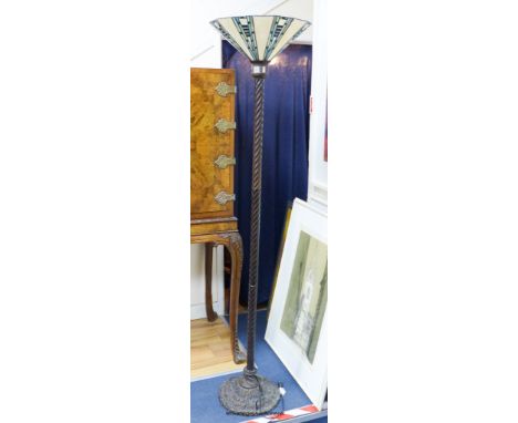   A Tiffany style bronzed metal standard lamp with stained glass shade, height 172cm