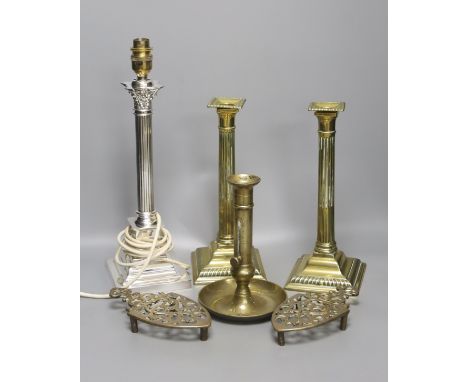   A pair of brass candlesticks, a telescopic candlestick and a silver plated table lamp base
