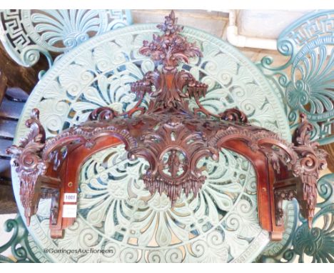   A carved mahogany bed canopy in the style of Thomas Chippendale, W.61cm H.63cm
