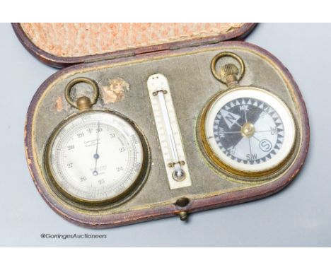   An Edwardian leather cased pocket barometer, thermometer and compass