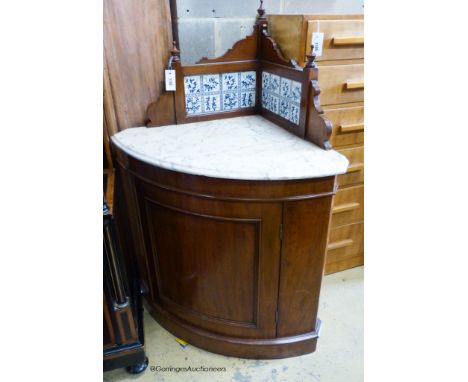   A Victorian mahogany marble topped tile back corner wash stand. W-82, D-58, H-120cm.