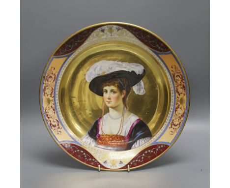   A 19th century Dresden  porcelain charger, painted with a portrait of a lady, Augustus Rex mark verso, 36cm diameter.