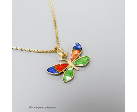   A three colour enamelled butterfly pendant, 23mm (enamel a.f.), on an Italian 750 yellow metal chain, 49cm, 5.2 grams.