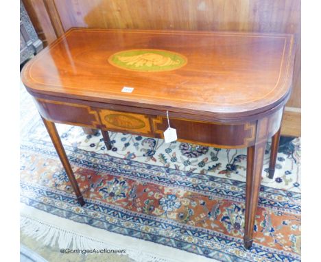   A George IV inlaid mahogany folding card table, width 91cm, depth 45cm, height 73cm