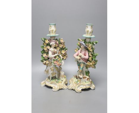  A pair of Derby style candlestick figures, height 27cm
