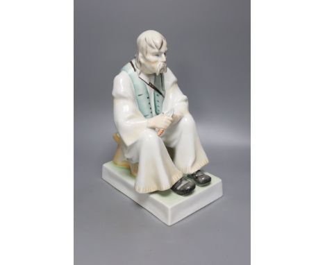   A Zsolnay porcelain figure of a seated peasant, height 33cm