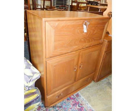   An Ercol elm Windsor fall front writing cabinet, width 82cm, depth 44cm, height 110cm