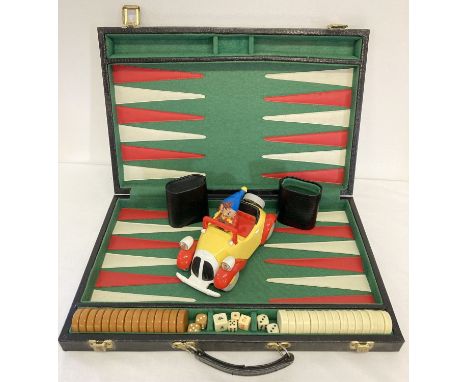 A cased backgammon set together with a battery operated Noddy car by Dekkertoys Ltd 1992.  