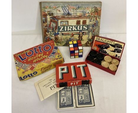 A small collection of vintage games and a German "Zirkus" children's book.  Games include a Rubix Cube, Pitt card game, Lotto