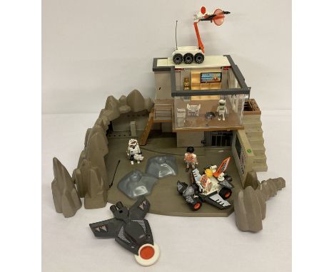 A Playmobile largest space playset with vehicles and figures.  