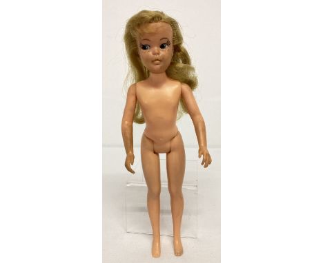 A vintage 1960's "Pepper" doll from the Tammy doll range by Ideal.  Approx. 9 inches tall. 
