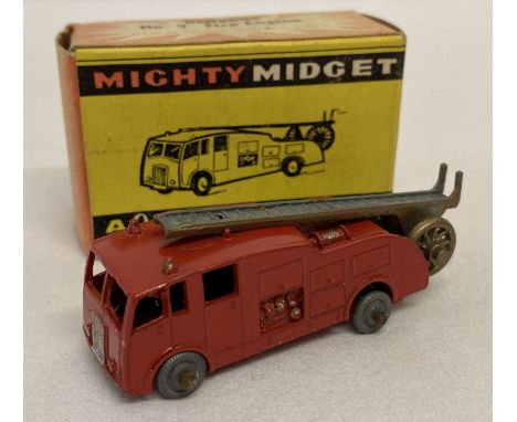A boxed 1950's Benbros Mighty Midget No 9 Fire Engine, in excellent condition.  Red engine body with unpainted metal wheels a