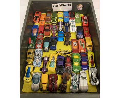 A tray of 45 Hot Wheels 1:72 scale diecast vehicles.  To include hot rods and futuristic designs. All in play worn condition.