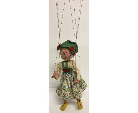 A vintage Tyrolean girl Pelham puppet, unboxed.  With wooden ball head, blonde hair and painted features. Composite hands wit