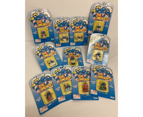 11 Schleich 1995 Peyo The Smurfs figures, in original unopened blister packs.  